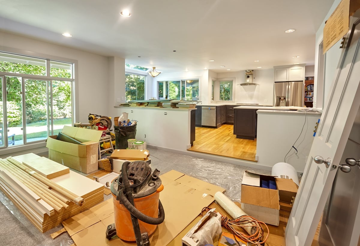 Remodeling tools and supplies in a family room under construction