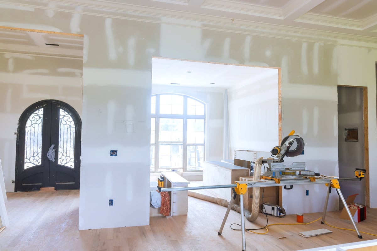 Modern living space being remodeled with tools and fresh finishes